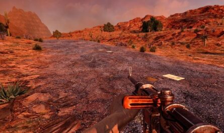A first-person view in 7 Days to Die showing a player holding a basic, worn firearm while standing on a cracked desert road surrounded by red rocky terrain and cacti under an orange sky